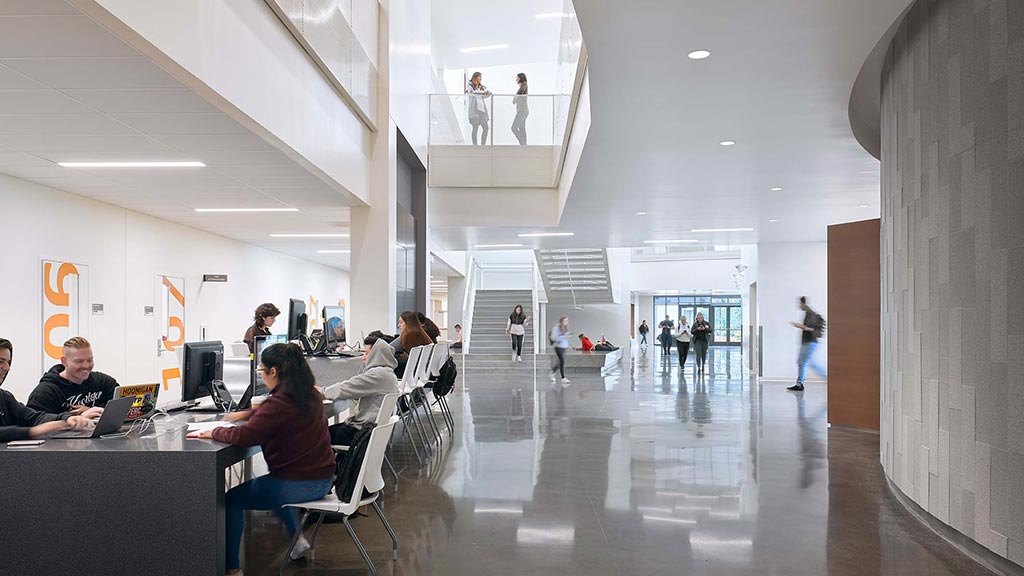 People sitting at tables in a room.