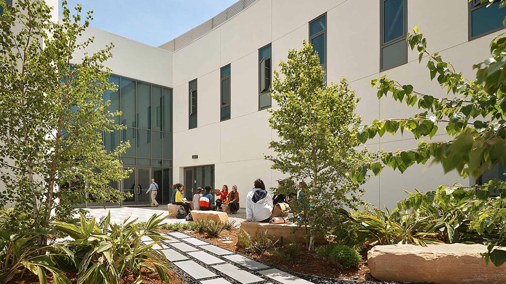 A group of people outside a building.