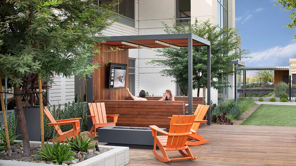 A building with a patio and chairs.