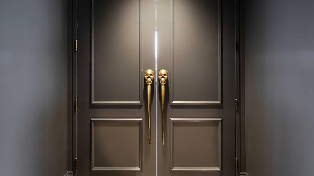 A large elevator with a couple of doors.