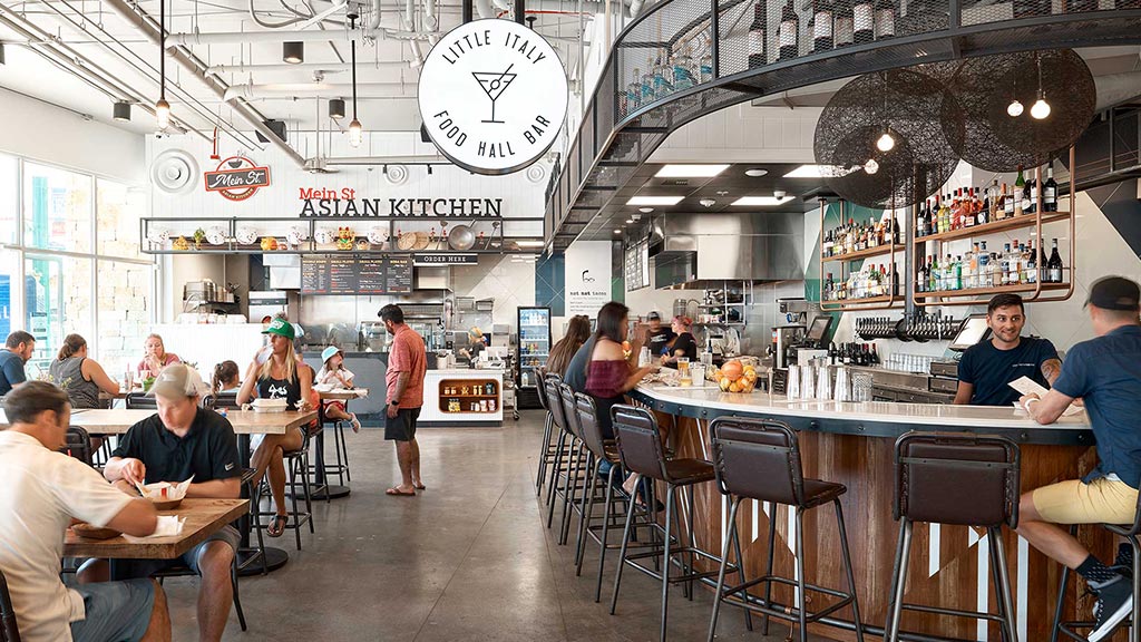 People sitting at tables in a restaurant.