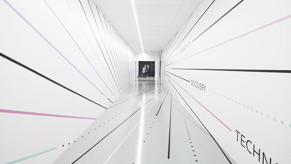 A person walking through a tunnel.