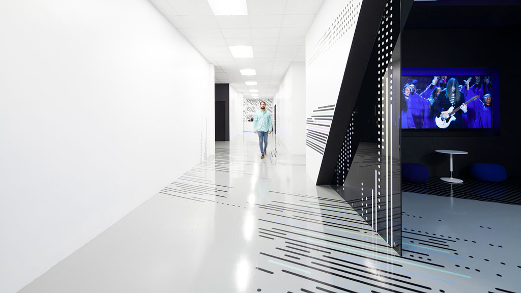 A person walking down a hall.