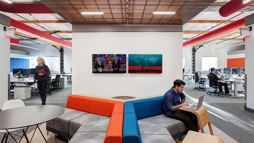 A man and a woman in an office.