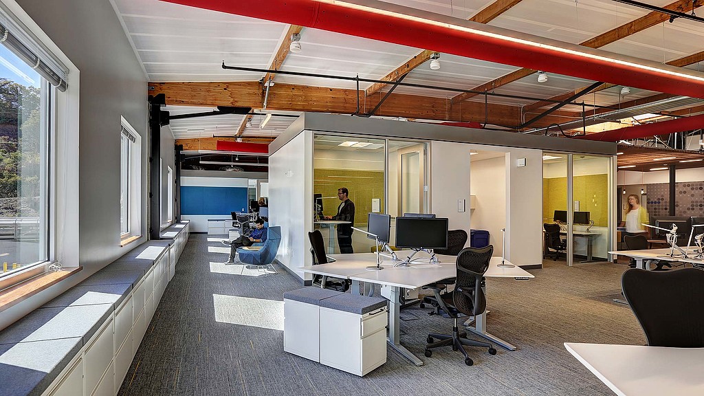 A room with a table and chairs.