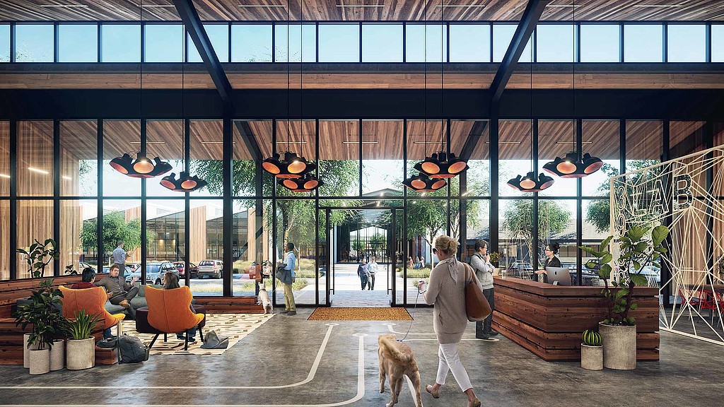 A person walking a dog in a large building.