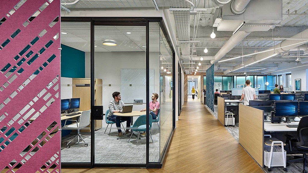 A group of people in an office.