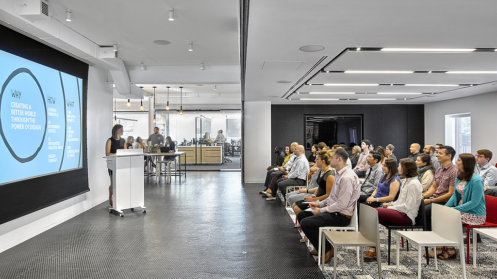 A group of people sitting in a room.