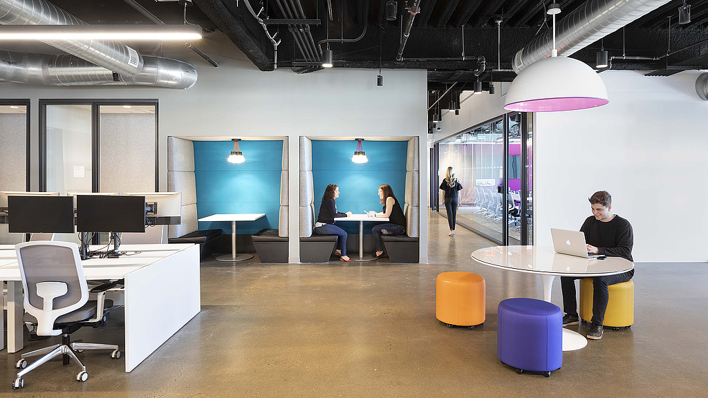 A group of people in an office.