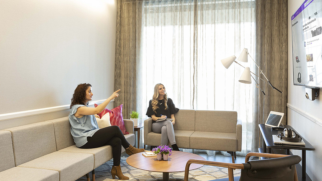 A woman sitting on a couch.