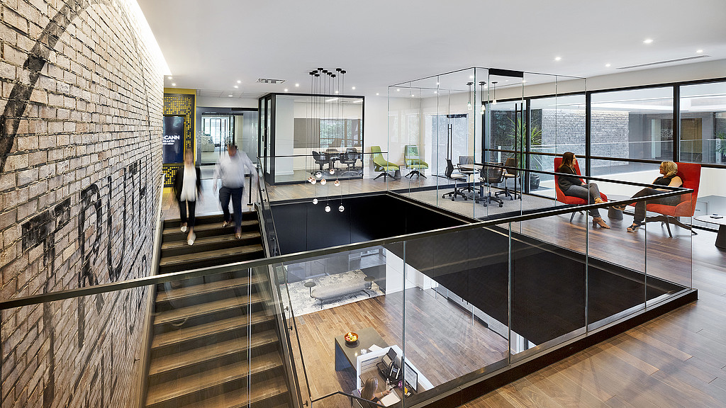 A modern looking kitchen with a glass counter.