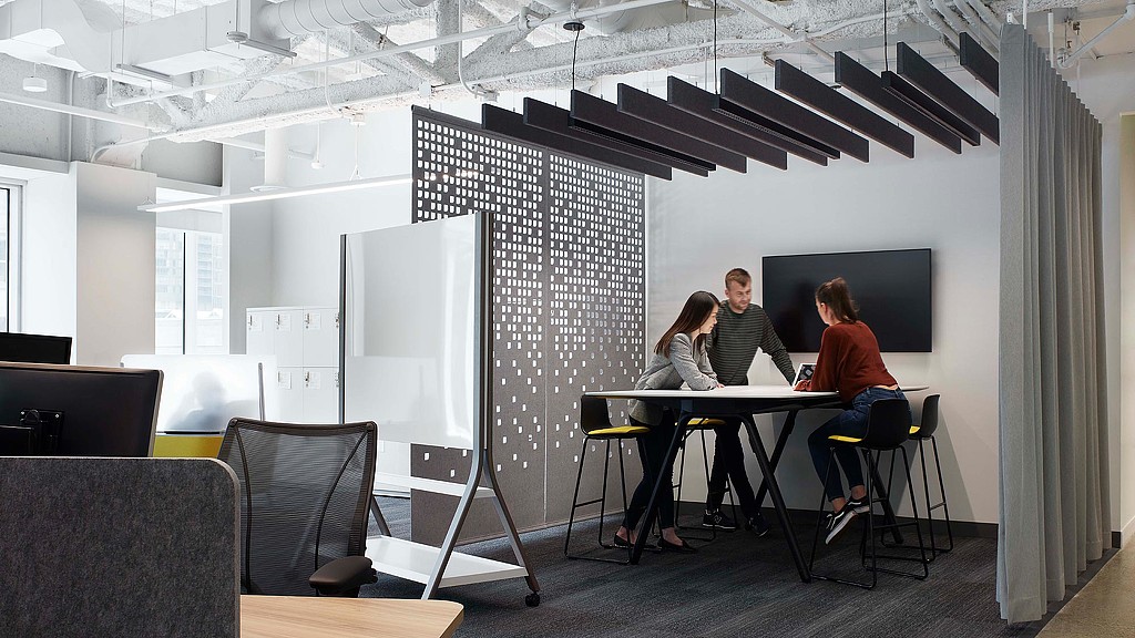 A group of people sitting at a table.