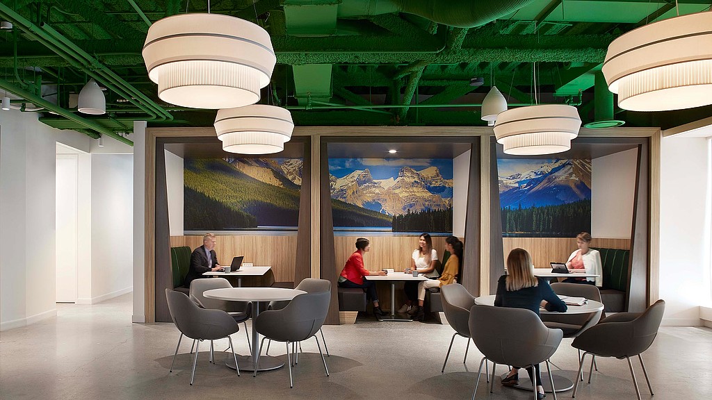 A group of people sitting at tables.