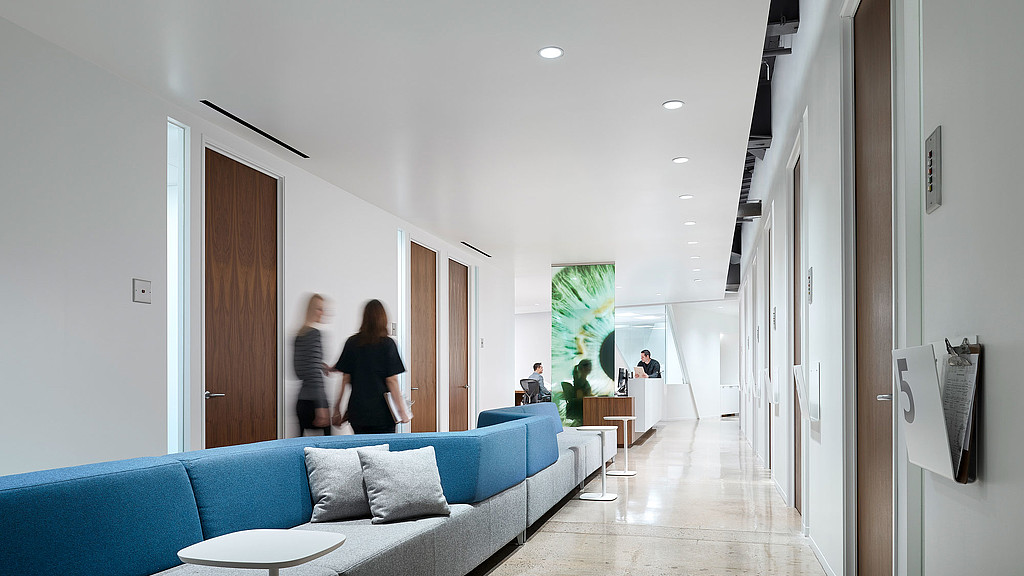 A room with a couch and a table.