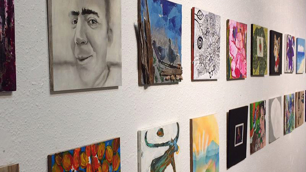 A wall with pictures on it.