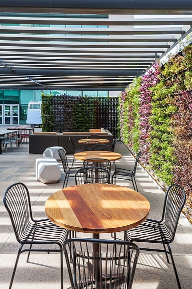 A group of tables and chairs outside.