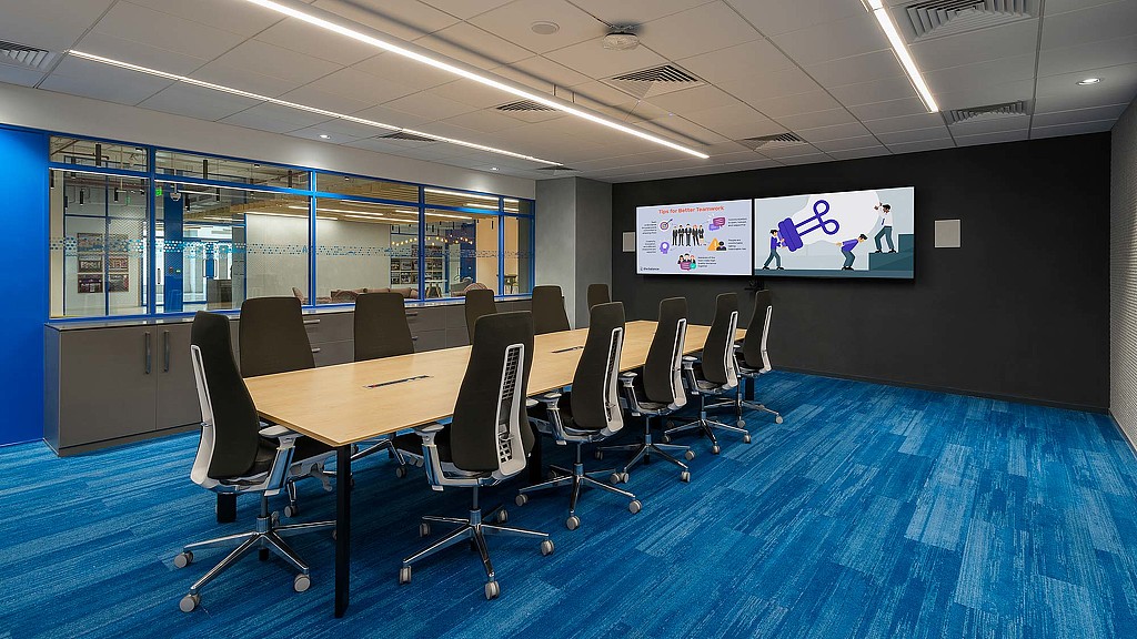 A room with a table and chairs.