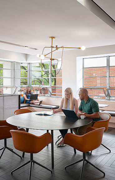 A group of people sitting at a table.