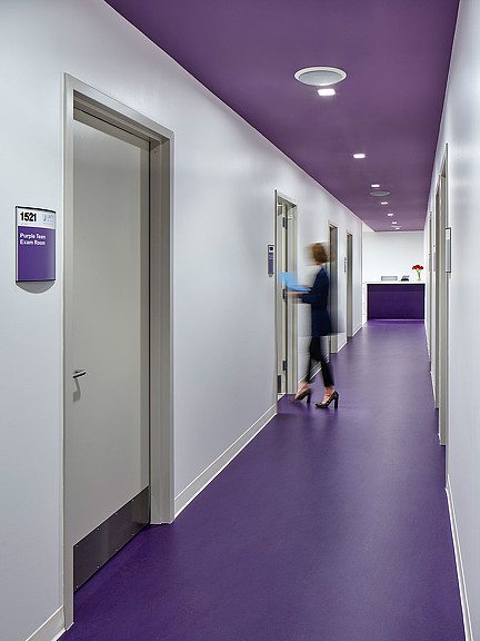 A person walking through a hallway.