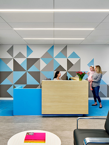 A few women standing at a counter.