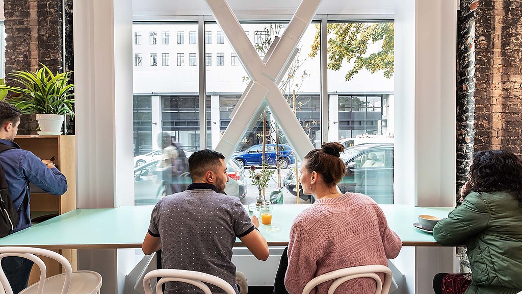 A group of people sitting at a table.