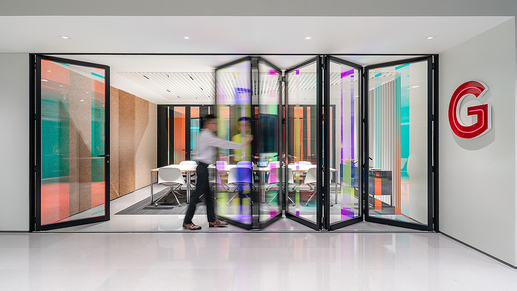 A person walking through a building.