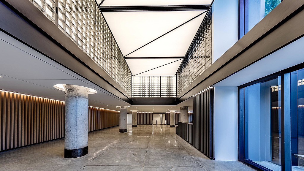 A long hallway with blue walls.