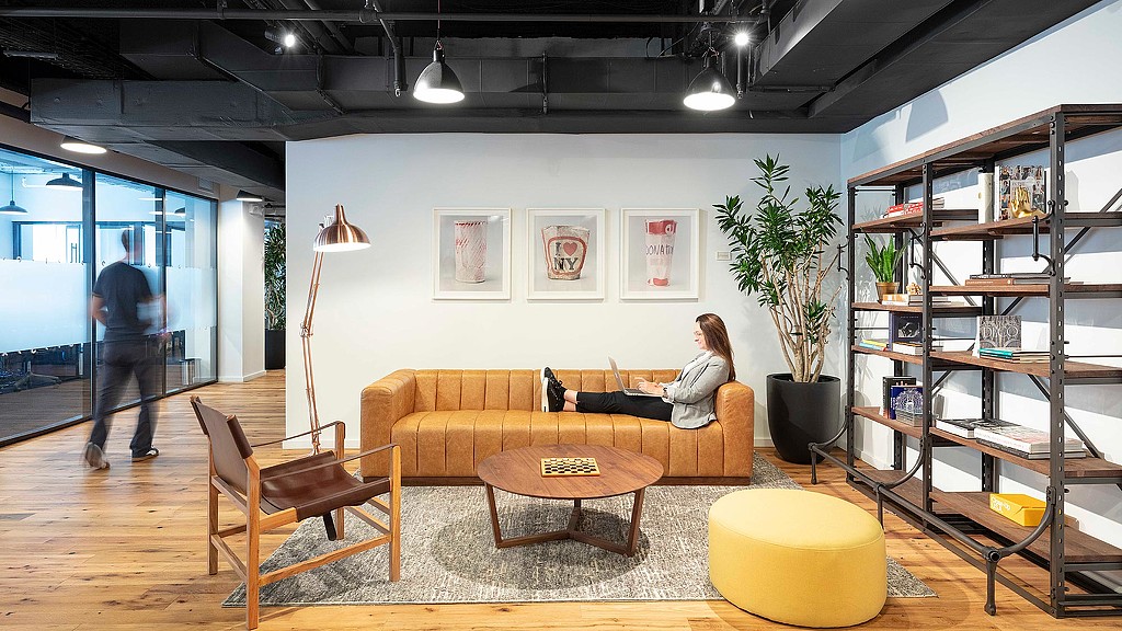 A person sitting on a couch.