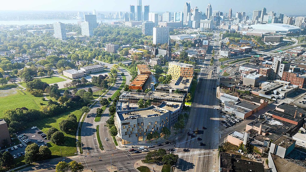 A city with a freeway and buildings.