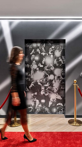 A person looking at a painting.