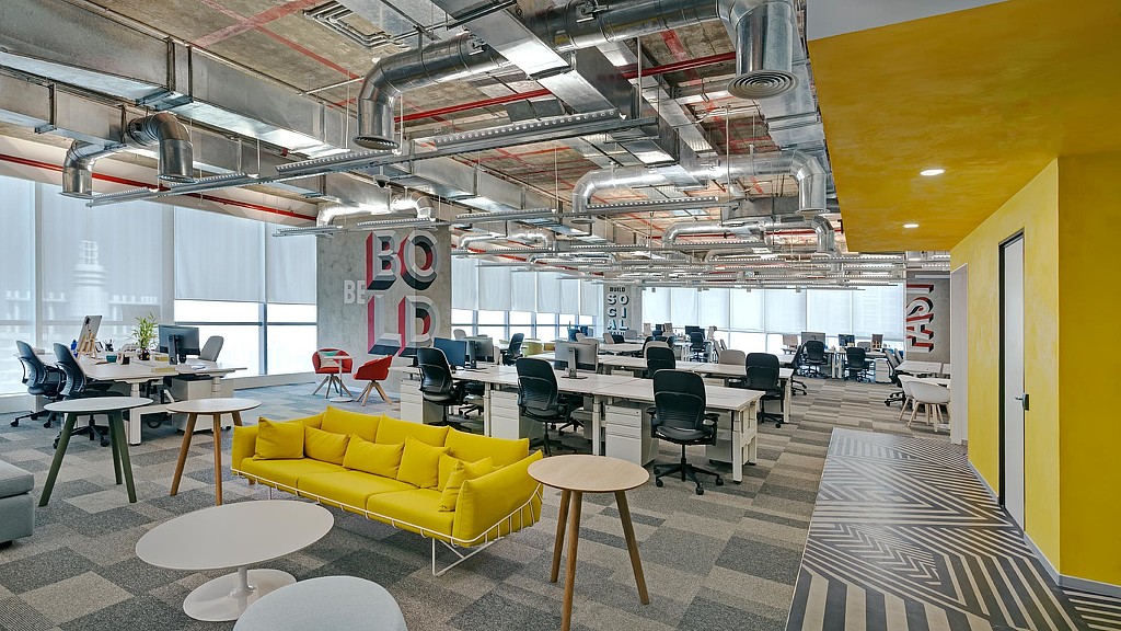 A room with tables and chairs.