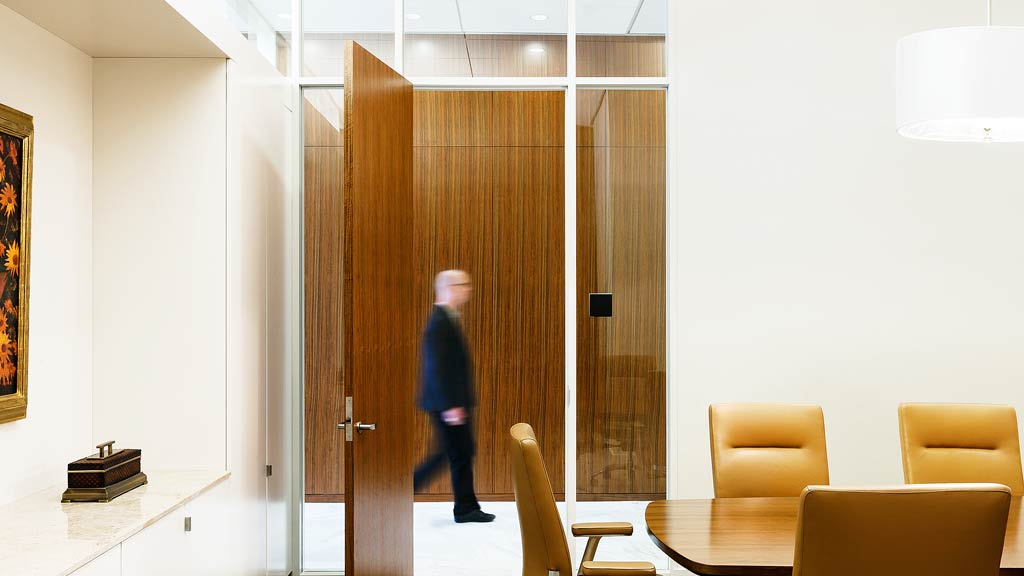 A person walking in a room.
