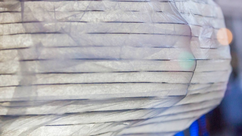 A close-up of a hand holding a piece of paper.