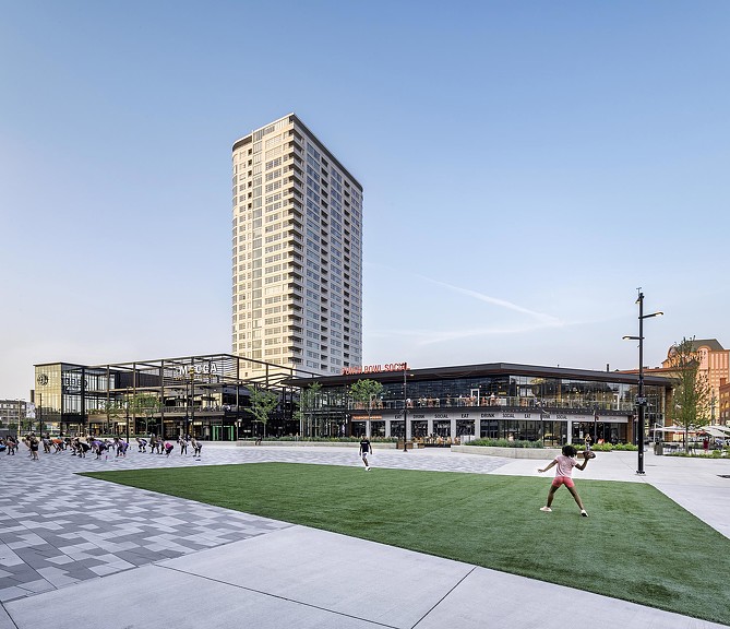A large building with a tall glass tower.