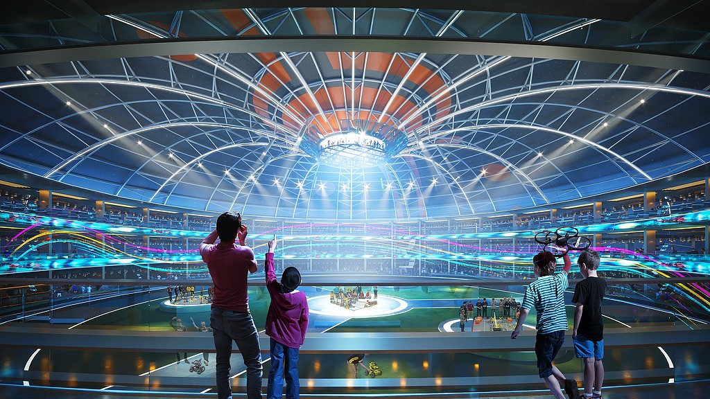 People standing in a large room with lights.