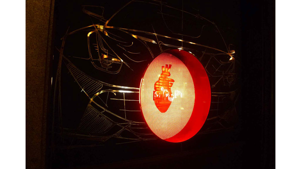 A basketball hoop with a ball in it.