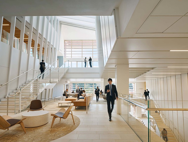 A person walking down a hall.