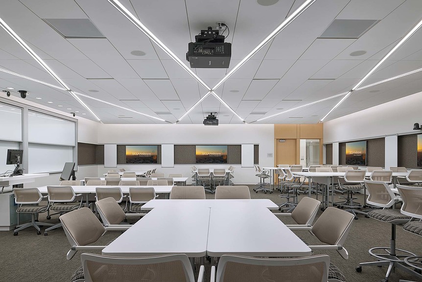 A room with tables and chairs.