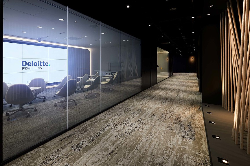 A room with a glass wall and a large window.