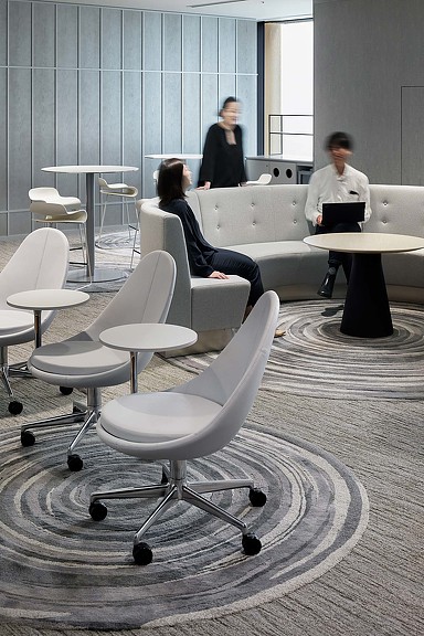 A group of people sitting in chairs.