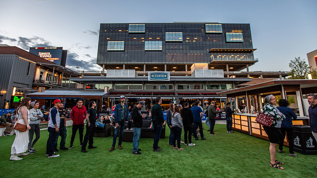 A group of people standing outside a building.