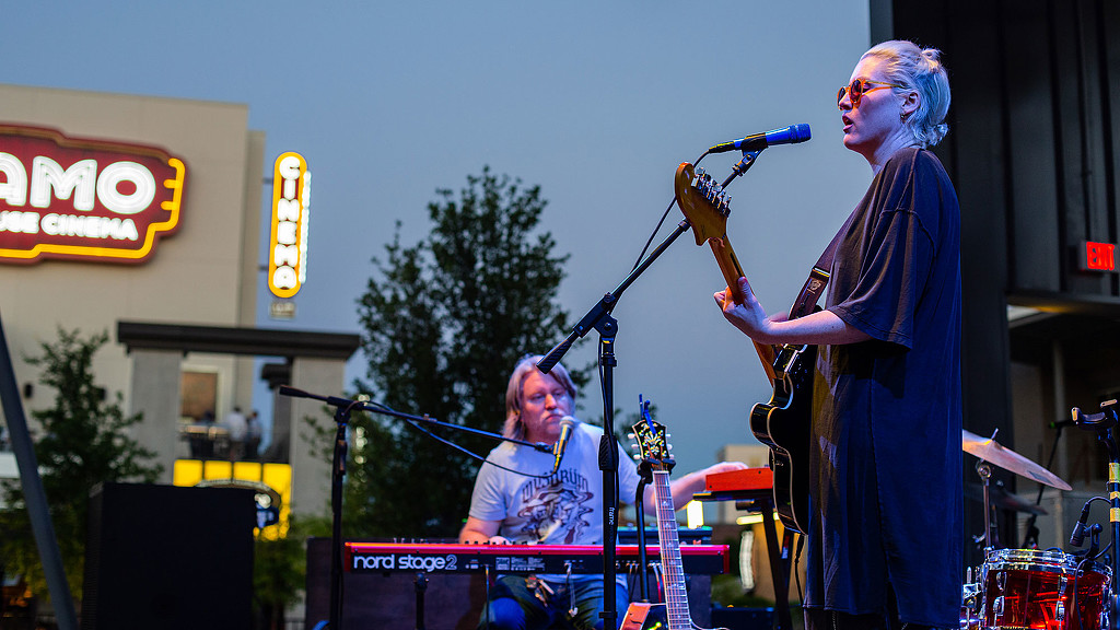 A couple of people playing musical instruments.