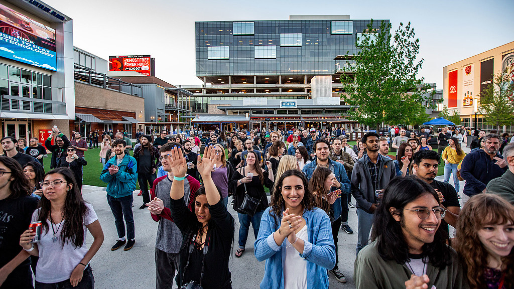 A large crowd of people walking.
