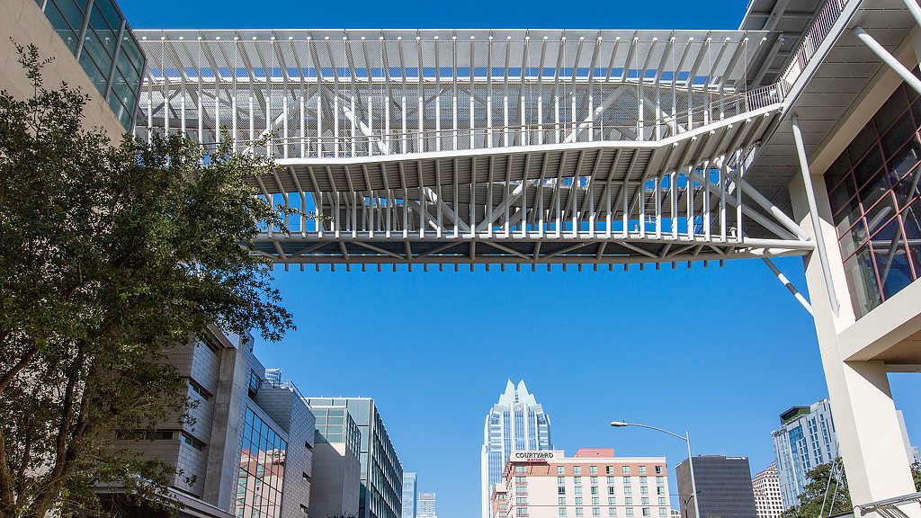 A bridge with a city in the background.