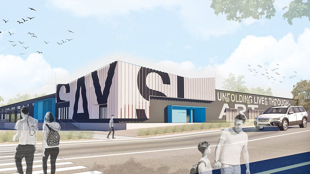 People walking in front of a building.