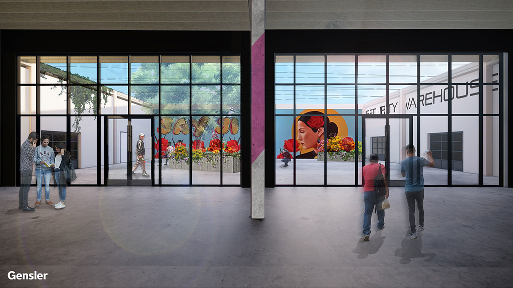 People walking in front of a building.