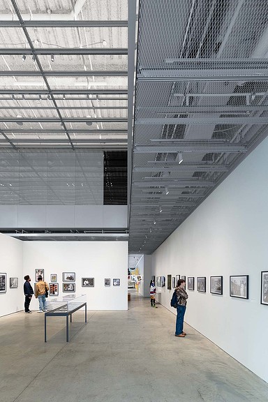 People walking in a museum.