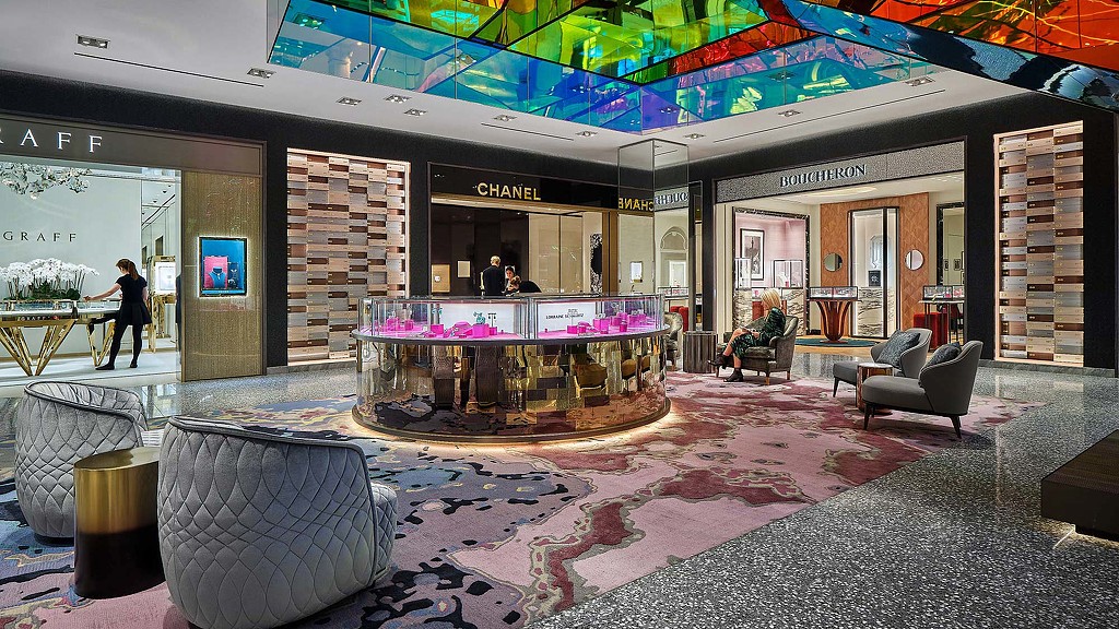 A room with a fountain and chairs.