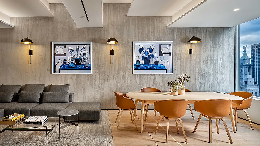 A room with a table and chairs.