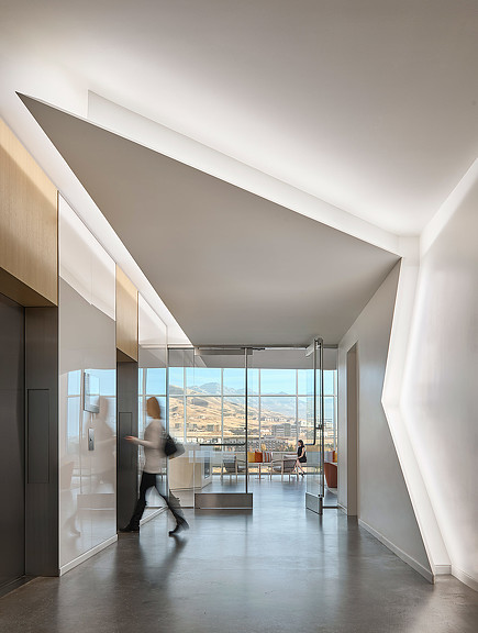 A person walking in a hallway.